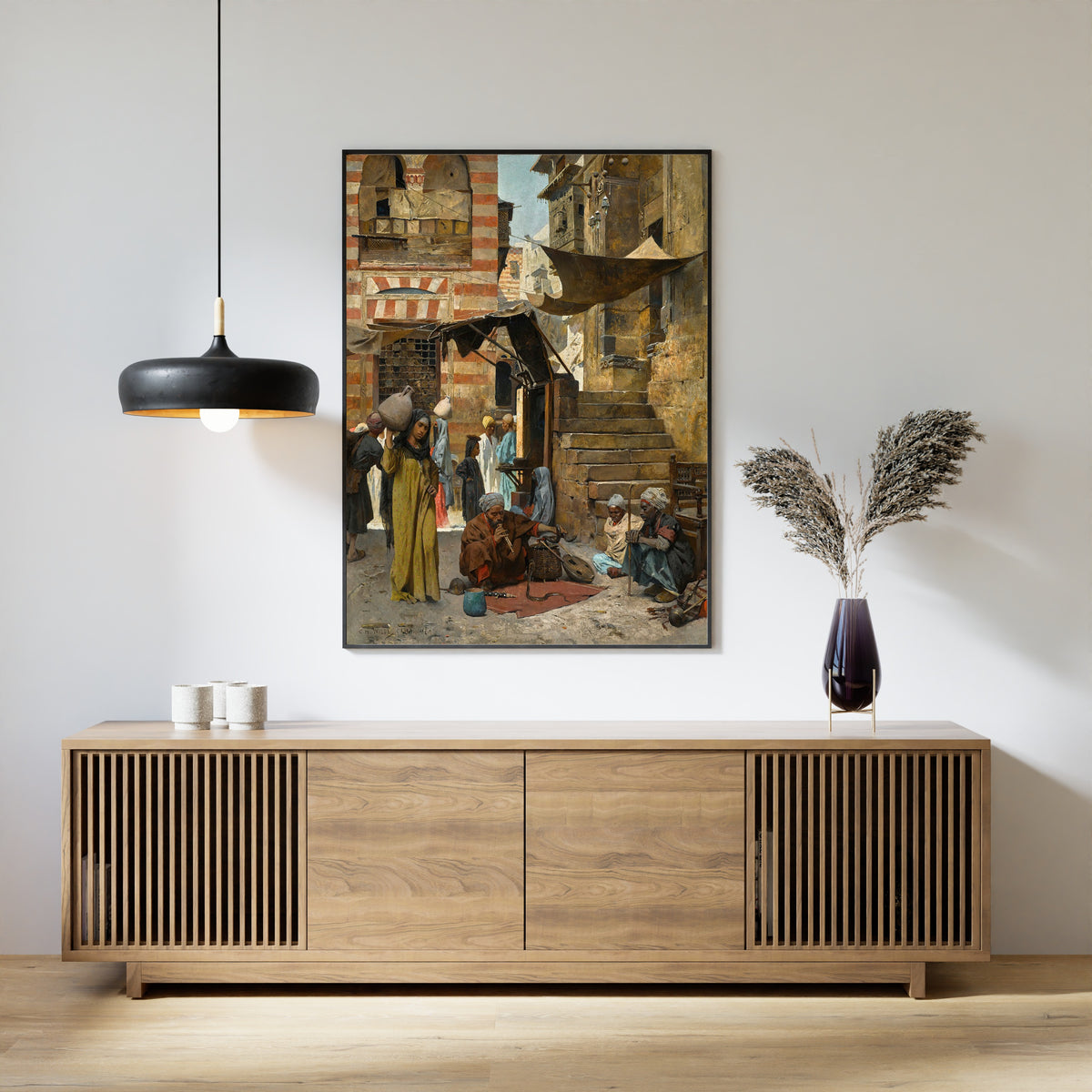 A Souk in Cairo by Charles Wilda — framed above a slatted wood sideboard