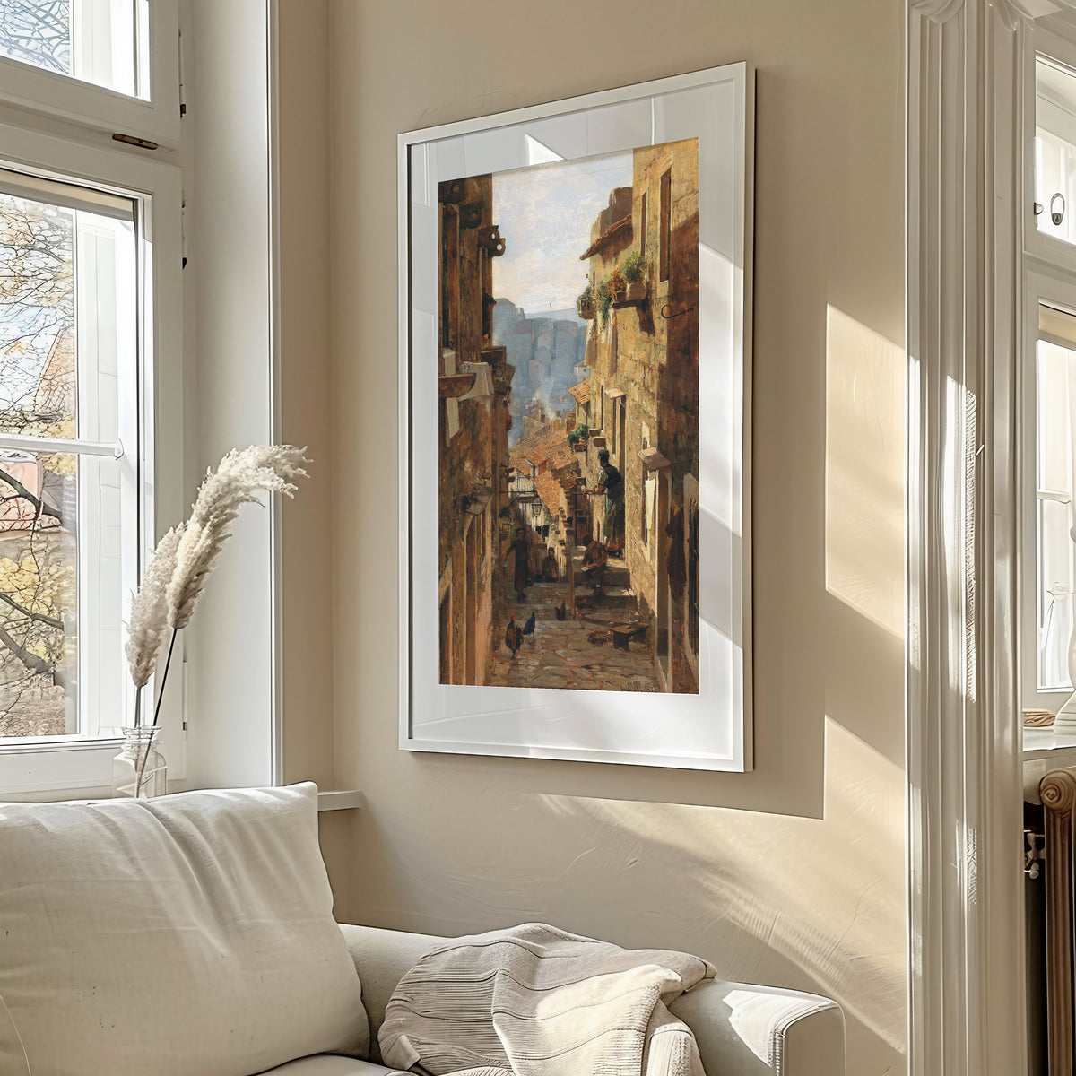 A Street in Ragusa by Carl Moll — framed in a sunlit living room above a sofa