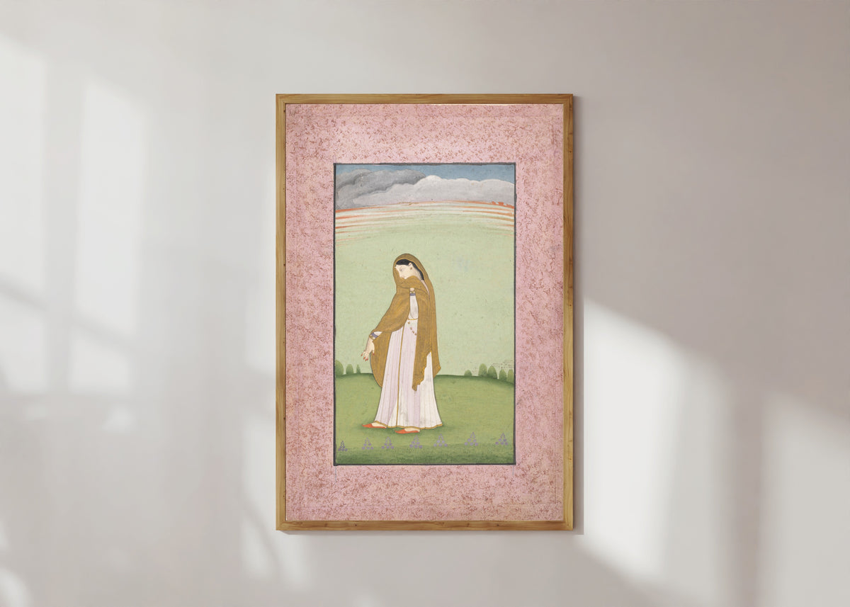 Framed art print of Abhisarika Nayika, a Heroine Longing for Her Lover by Kangra school, in a light wood frame on a sunlit white wall