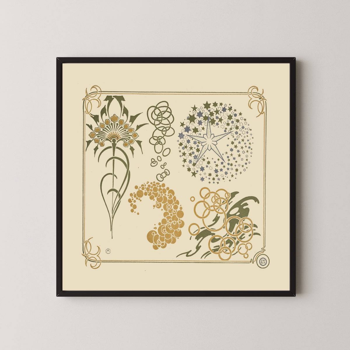 Framed art print of Abstract design based on stars, circles and leaves by Alphonse Mucha, in a black frame on a pale wall