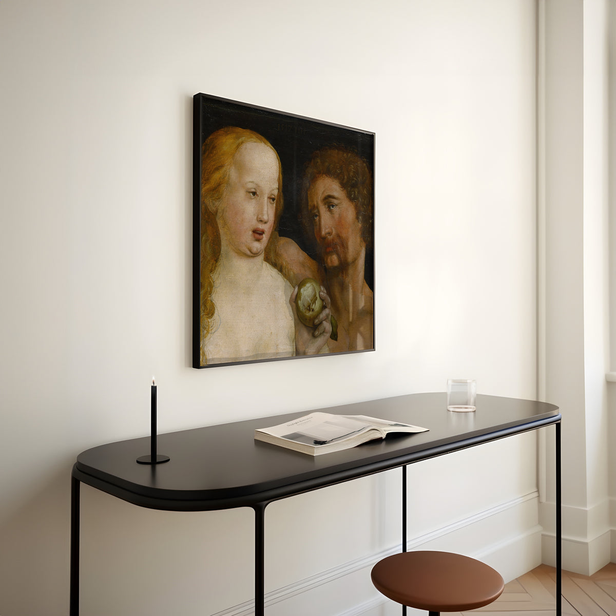 Framed art print of Adam and Eve by Hans Holbein the Younger, above a slim black console table