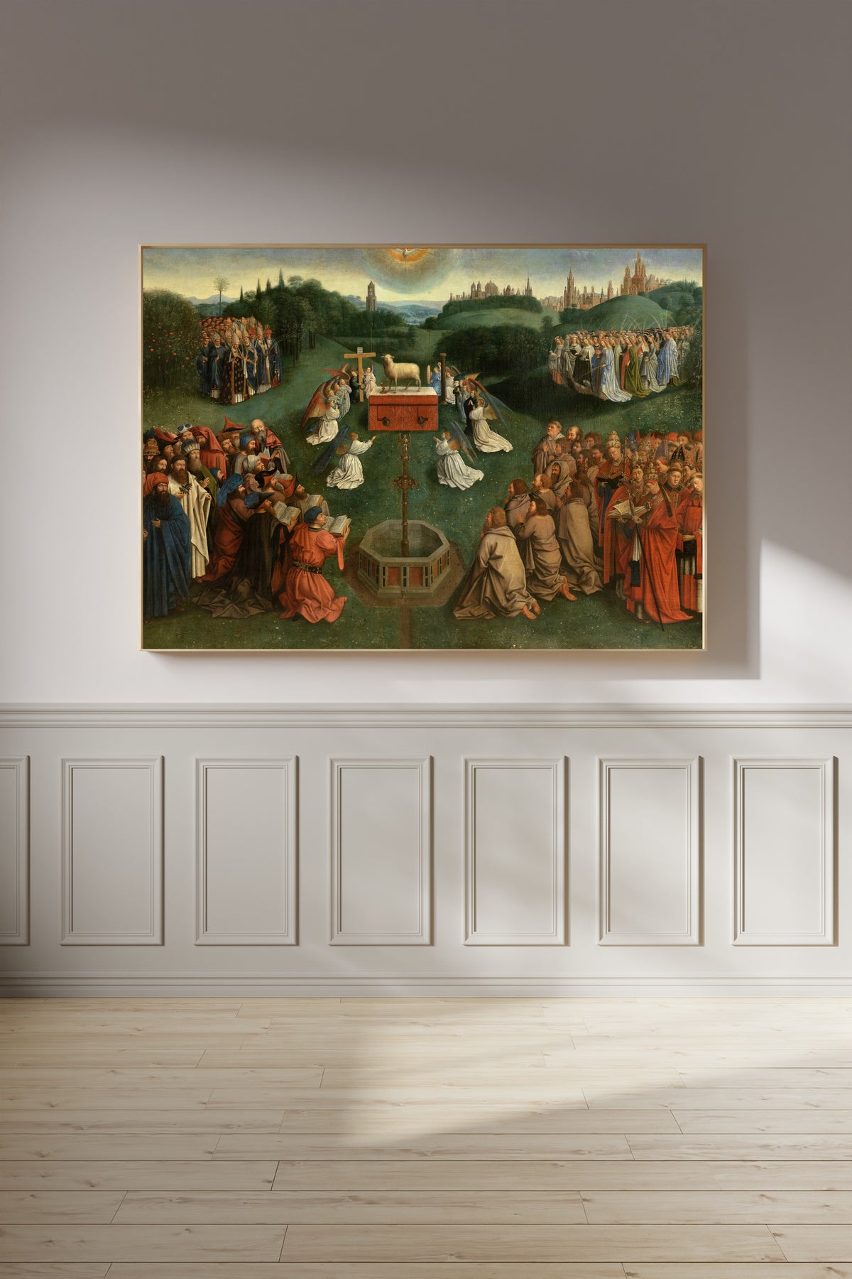 Framed art print of Adoration of the Lamb by Jan van Eyck, on a panelled wall in afternoon light