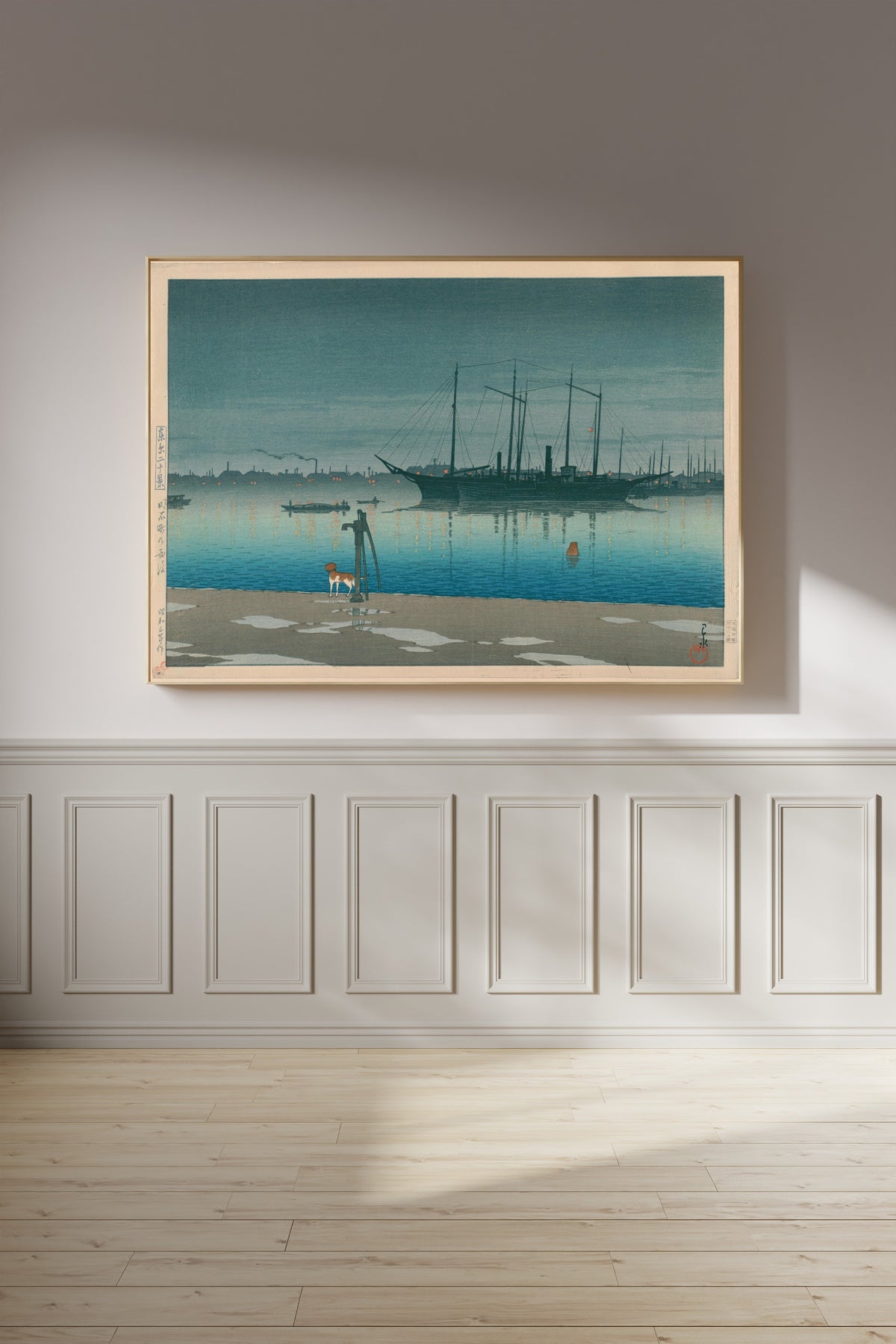 Framed art print of Akashi-cho After Rain by Kawase Hasui, on a panelled wall in afternoon light