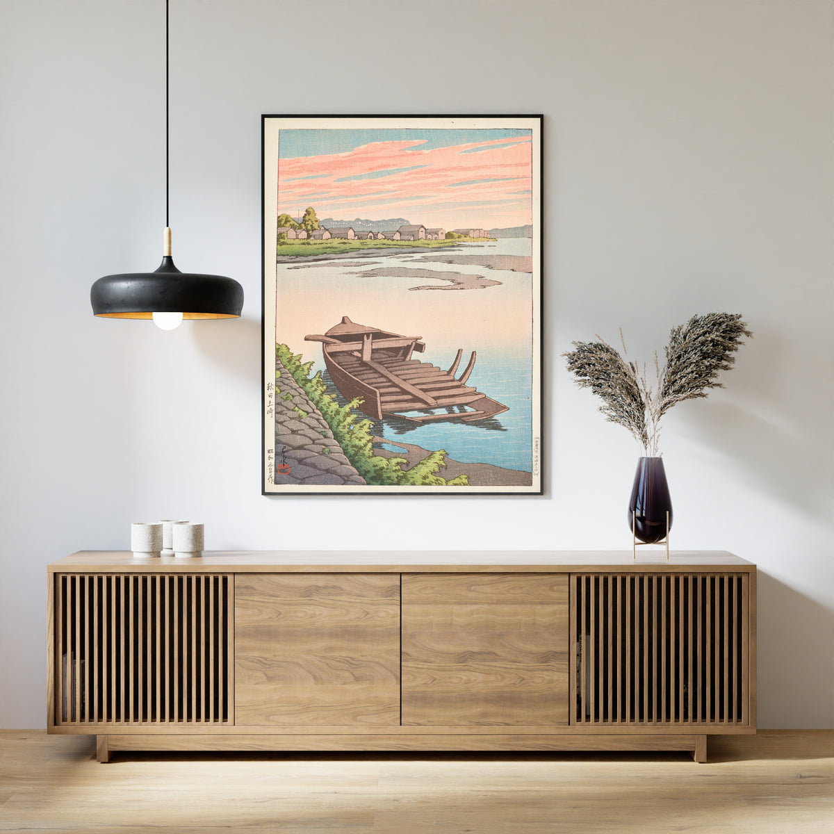 Framed art print of Akita Tsuchizaki by Kawase Hasui, above a slatted wood sideboard