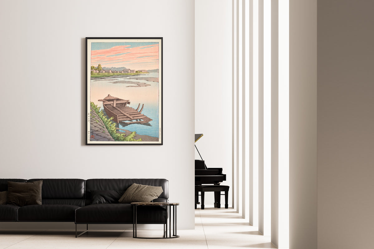 Framed art print of Akita Tsuchizaki by Kawase Hasui, on the wall of a minimal living room