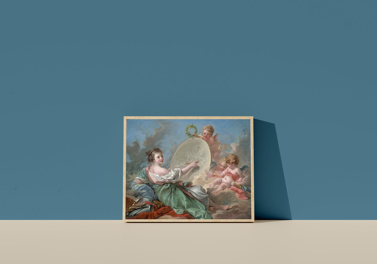 Framed art print of Allegory of Painting by François Boucher, in a light wood frame leaning on a blue wall