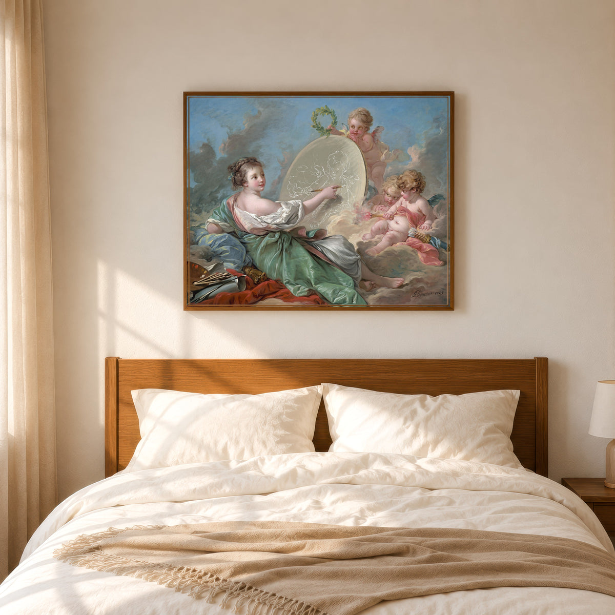 Framed art print of Allegory of Painting by François Boucher, in a slim wood frame above a bed in a sunlit bedroom