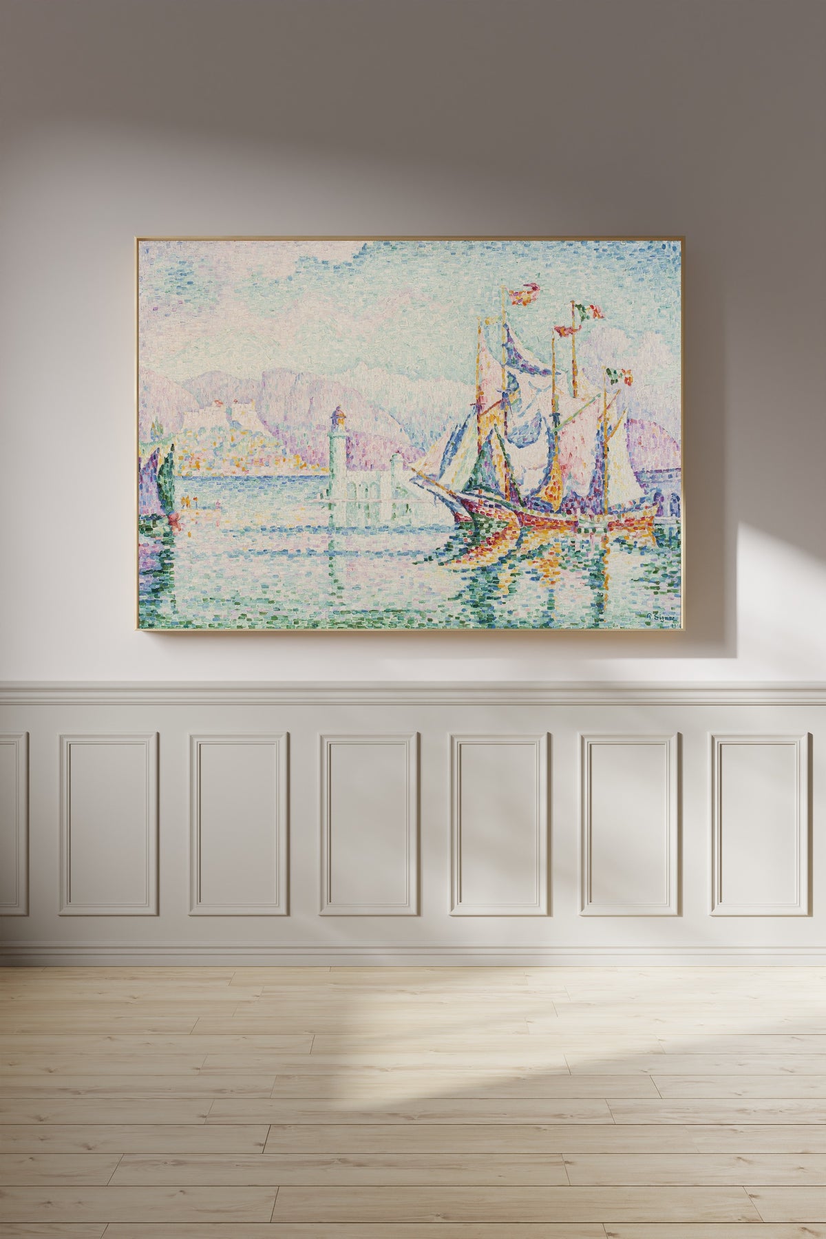 Framed art print of Antibes, Morning by Paul Signac, on a panelled wall in afternoon light