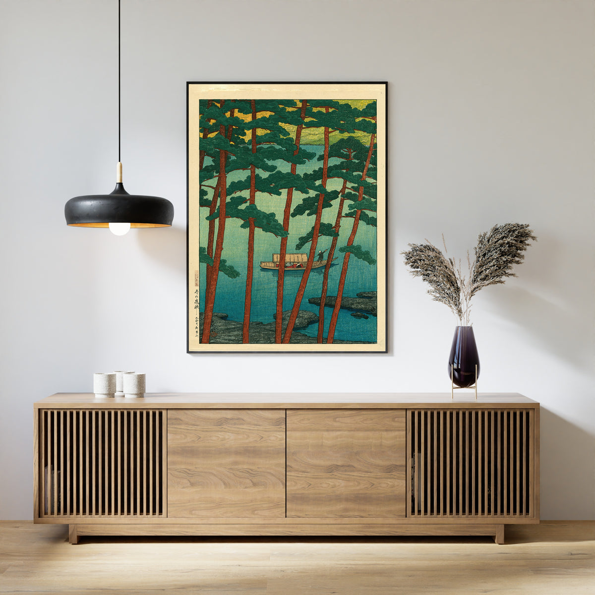 Framed art print of Arashiyama in Winter by Kawase Hasui, above a slatted wood sideboard