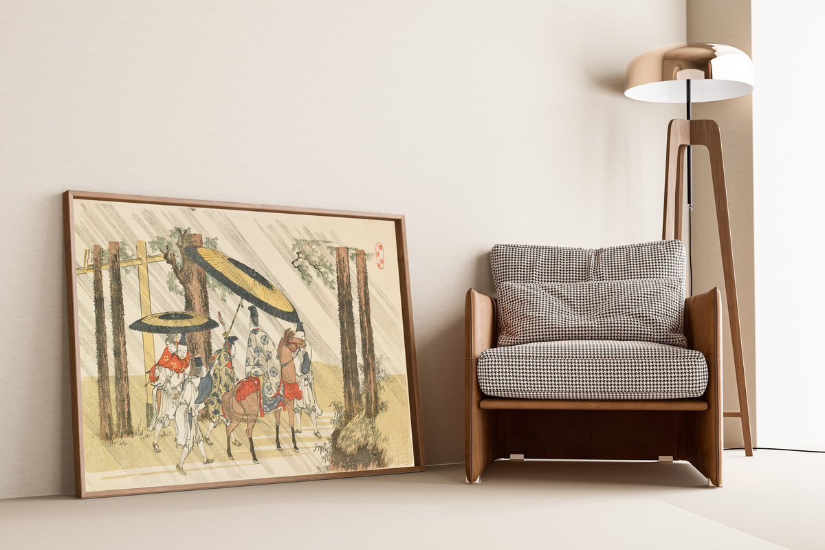 Framed art print of Aridōshi Shrine by Katsushika Hokusai, leaning against a wall beside an armchair and a floor lamp