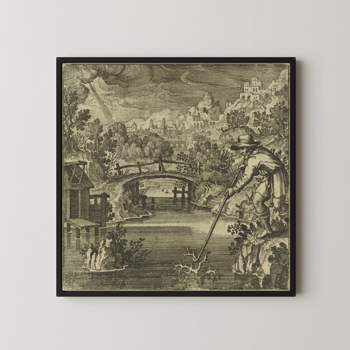 Framed art print of Atalanta Fugiens, Emblem 32: As Coral Grows Under Water and Hardens in the Air, So Does… by Michael Maier, in a black frame on a pale wall