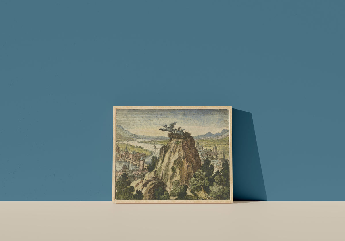 Framed art print of Atalanta Fugiens, Emblem 7: A Young Chick Attempts to Fly Out of Its Own… by Michael Maier, in a light wood frame leaning on a blue wall