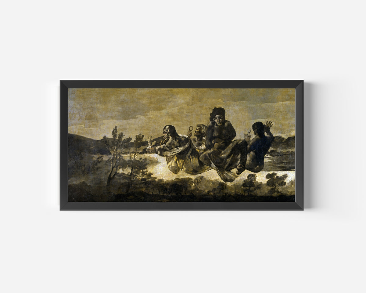 Framed art print of Atropos (The Fates) by Francisco de Goya, in a wide black frame on a plain white wall