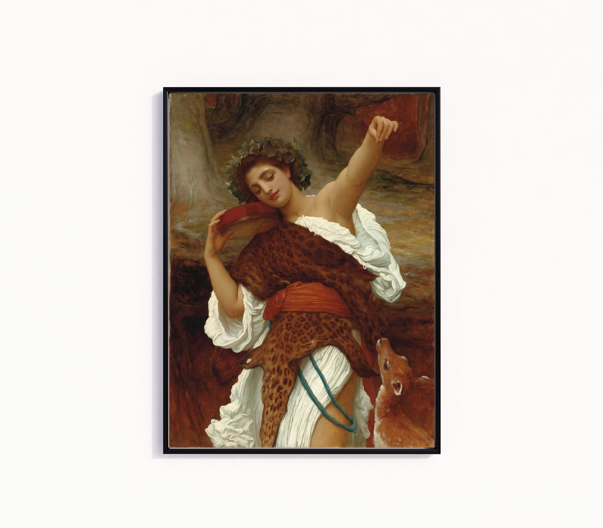 Framed art print of Bacchante by Frederic Leighton, in a slim black frame on a plain white wall