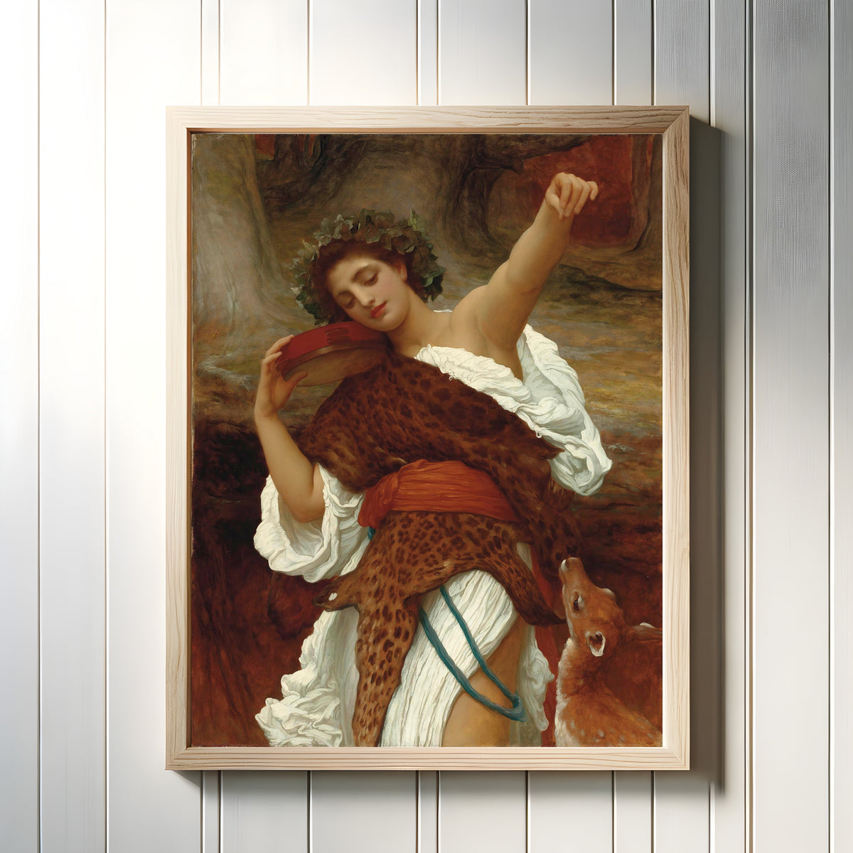 Framed art print of Bacchante by Frederic Leighton, in a light wood frame on a white panelled wall