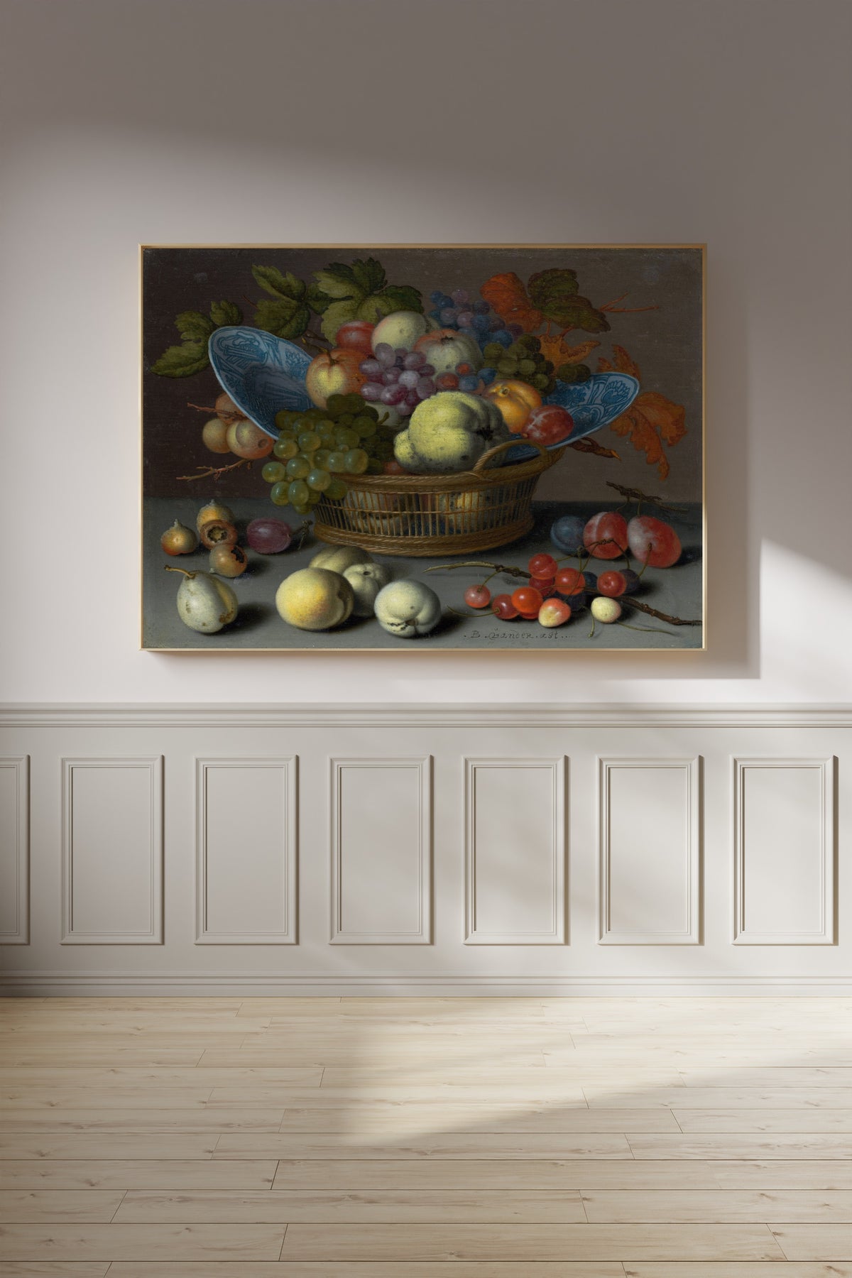 Basket of Fruits by Balthasar van der Ast — framed on a panelled wall in afternoon light