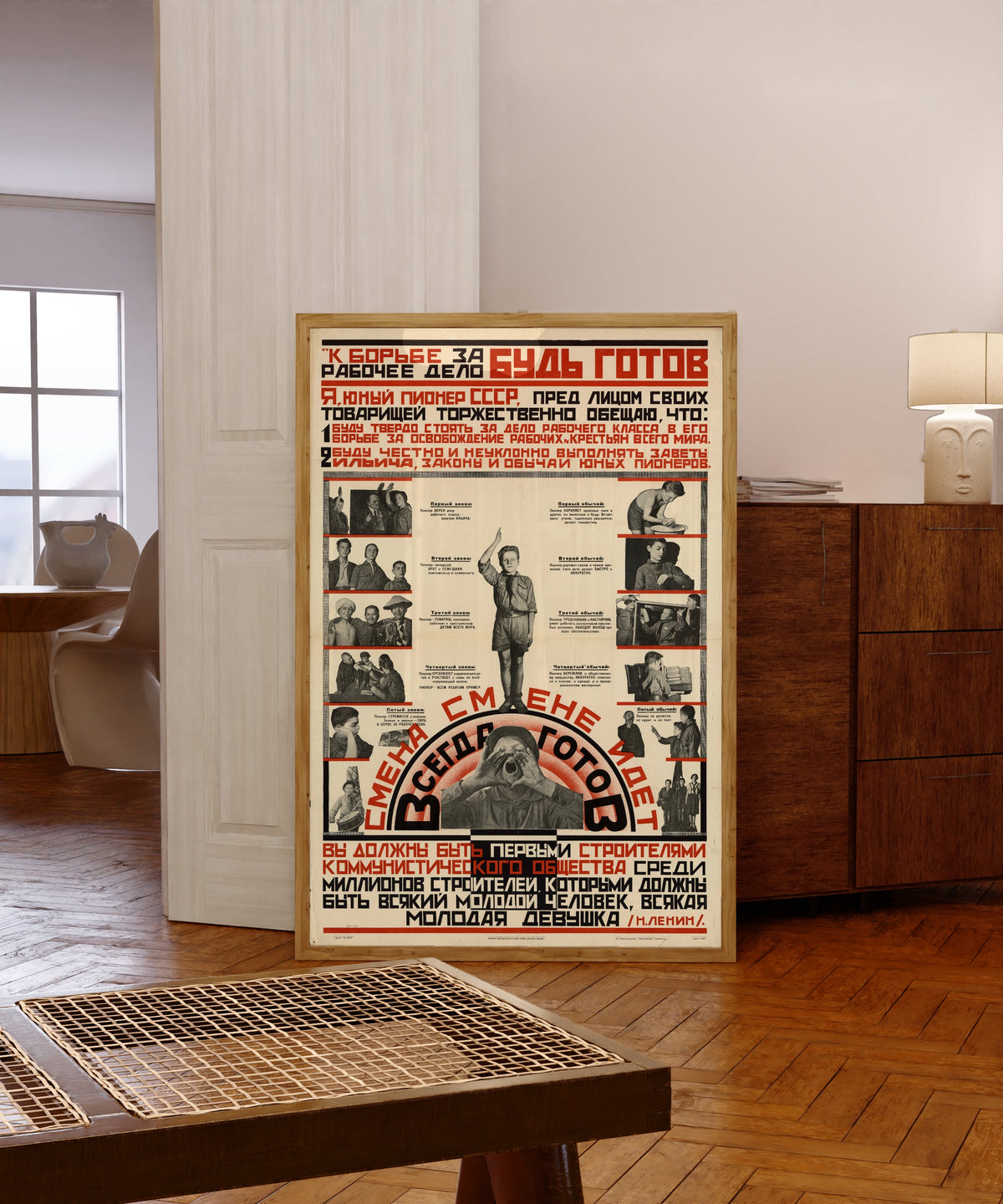 Framed art print of Be ready for the struggle for the workers' cause! Always ready! A new…, in a light wood frame leaning in a warm room with a parquet floor