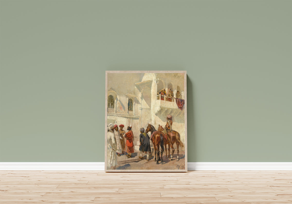 Framed art print of Before the Hunt by Edwin Lord Weeks, in a light wood frame leaning on a sage green wall above a wooden floor