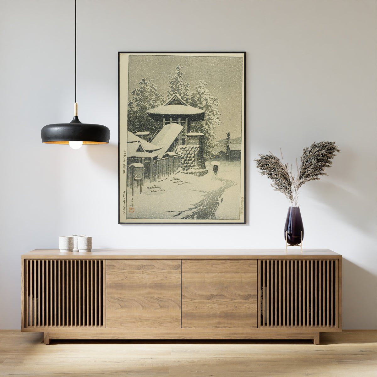 Framed art print of Bell Tower, Mount Koya by Kawase Hasui, above a slatted wood sideboard