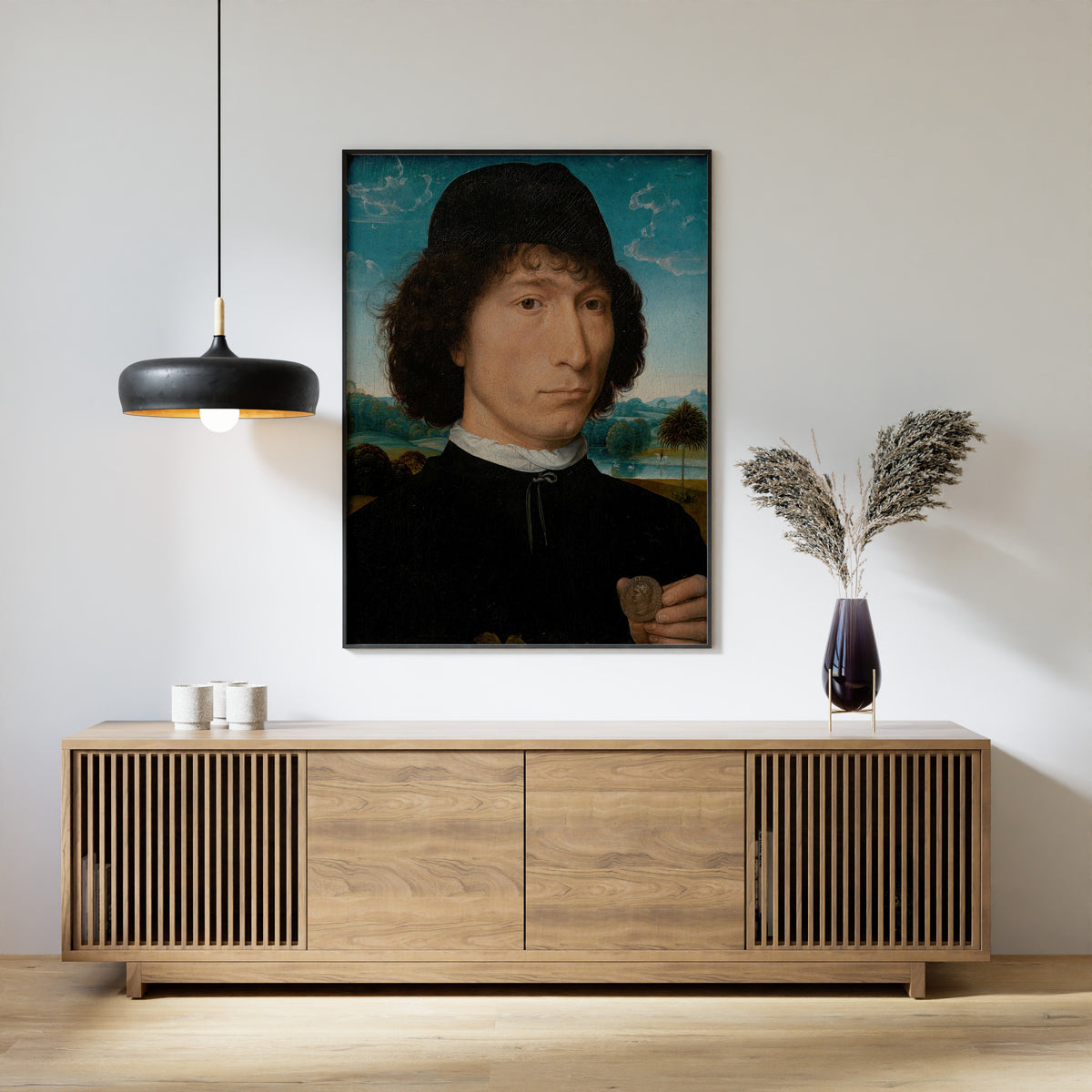 Framed art print of Bernardo Bembo, Statesman and Ambassador of Venice by Hans Memling, above a slatted wood sideboard