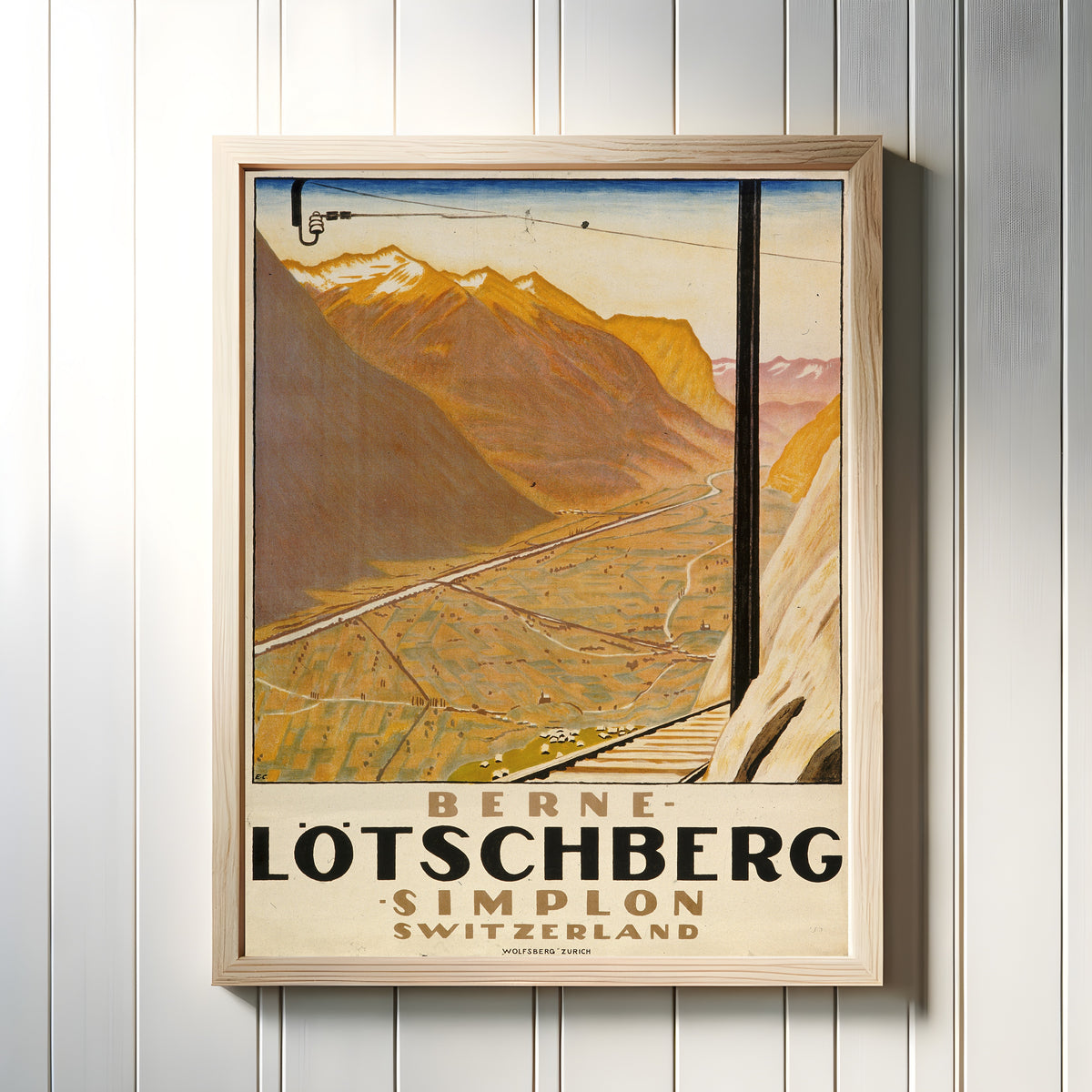 Framed art print of Berne-Lötschberg-Simplon: Switzerland by Emil Cardinaux, in a light wood frame on a white panelled wall