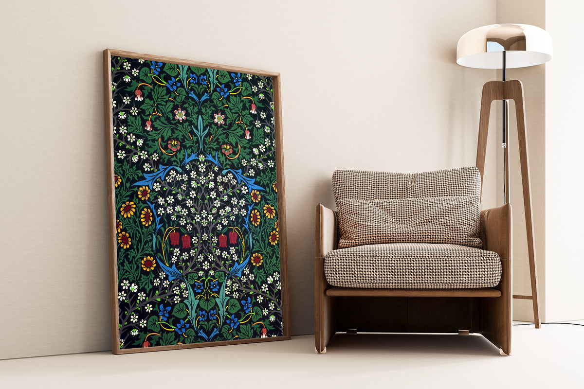 Framed art print of Blackthorn by John Henry Dearle, leaning against a wall beside an armchair and a floor lamp