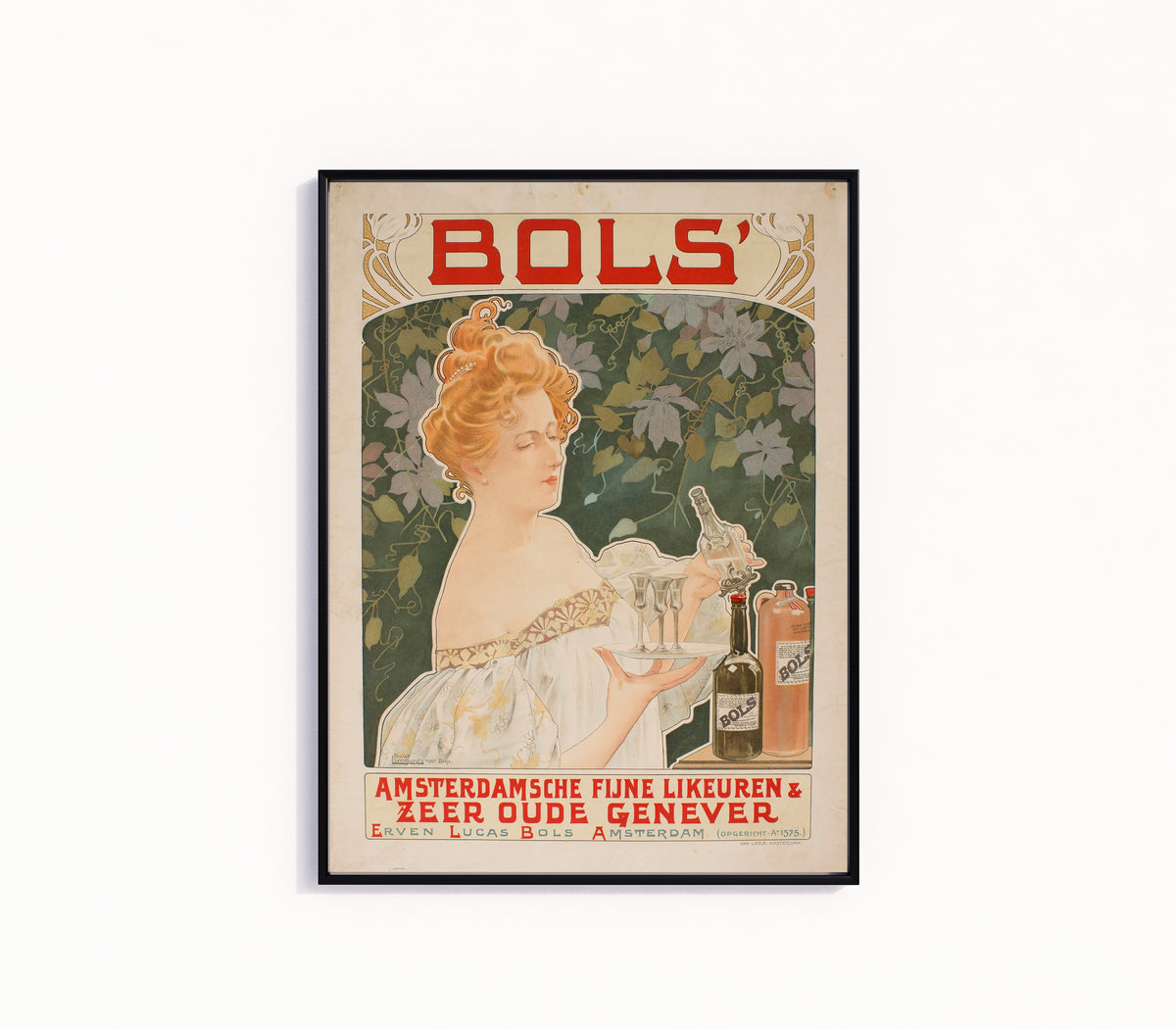 Framed art print of Bols' Amsterdamsche Fijne Likeuren by Henri Privat-Livemont, in a slim black frame on a plain white wall