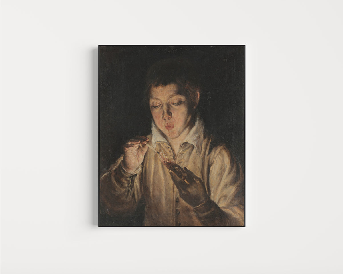Framed art print of Boy Blowing an Ember by El Greco, in a slim black frame on a plain white wall
