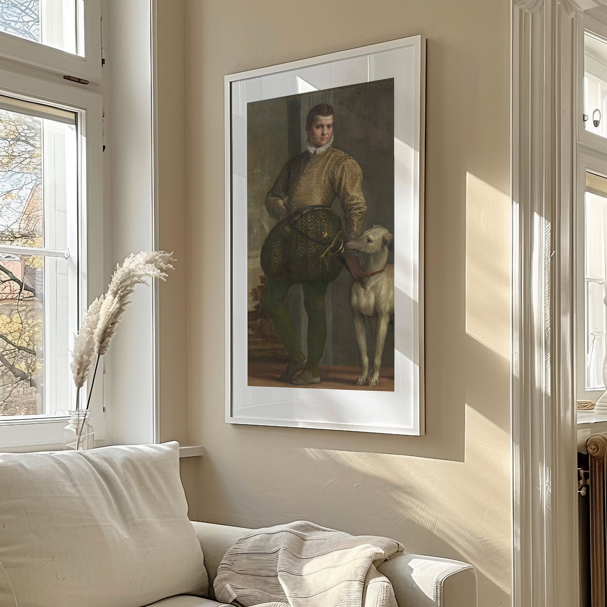 Framed art print of Boy with a Greyhound by Paolo Veronese, in a sunlit living room above a sofa