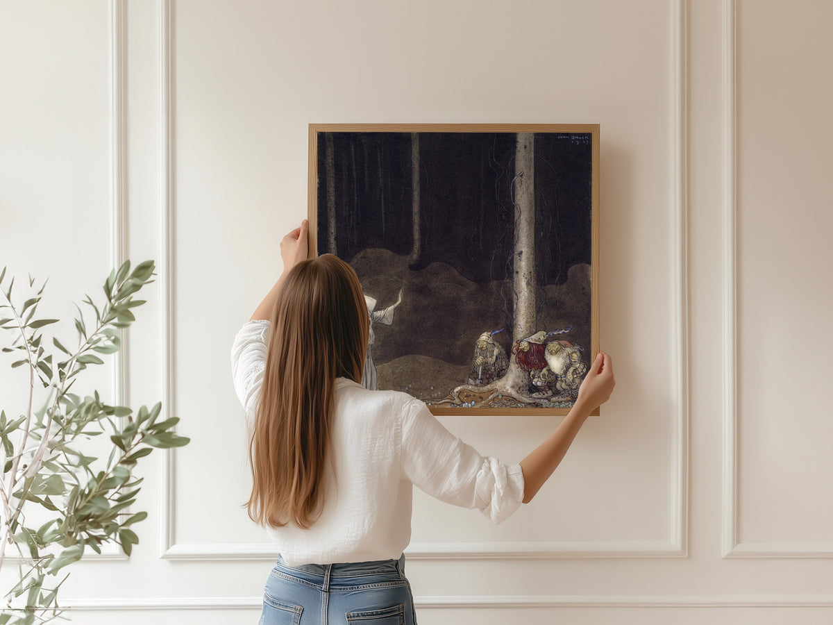 Framed art print of Brother St. Martin and the Three Trolls by John Bauer, hung on a panelled wall