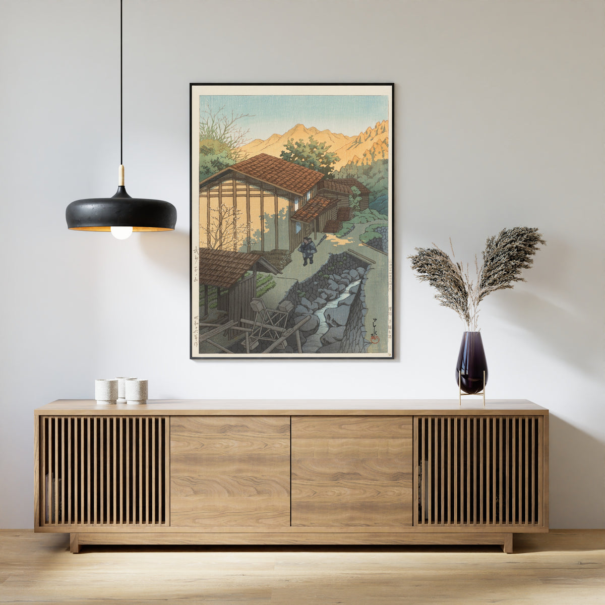 Framed art print of Bushu Nenoyama by Kawase Hasui, above a slatted wood sideboard