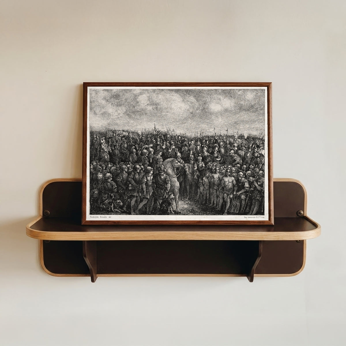 Framed art print of Caesar and his Prisoners by Rodolphe Bresdin, in a dark wood frame resting on a wall shelf