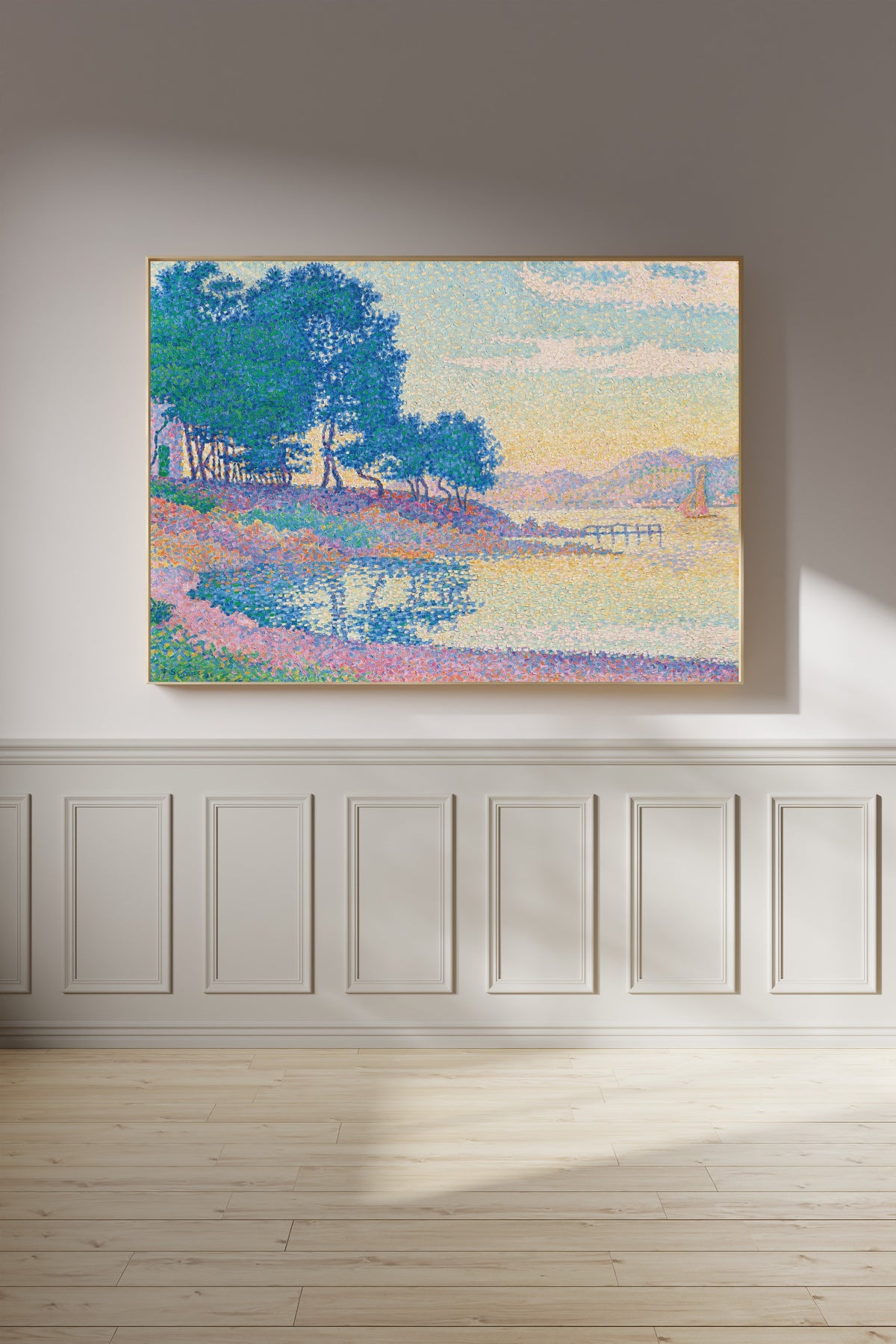 Framed art print of Calanque des Canoubiers, Saint-Tropez by Paul Signac, on a panelled wall in afternoon light