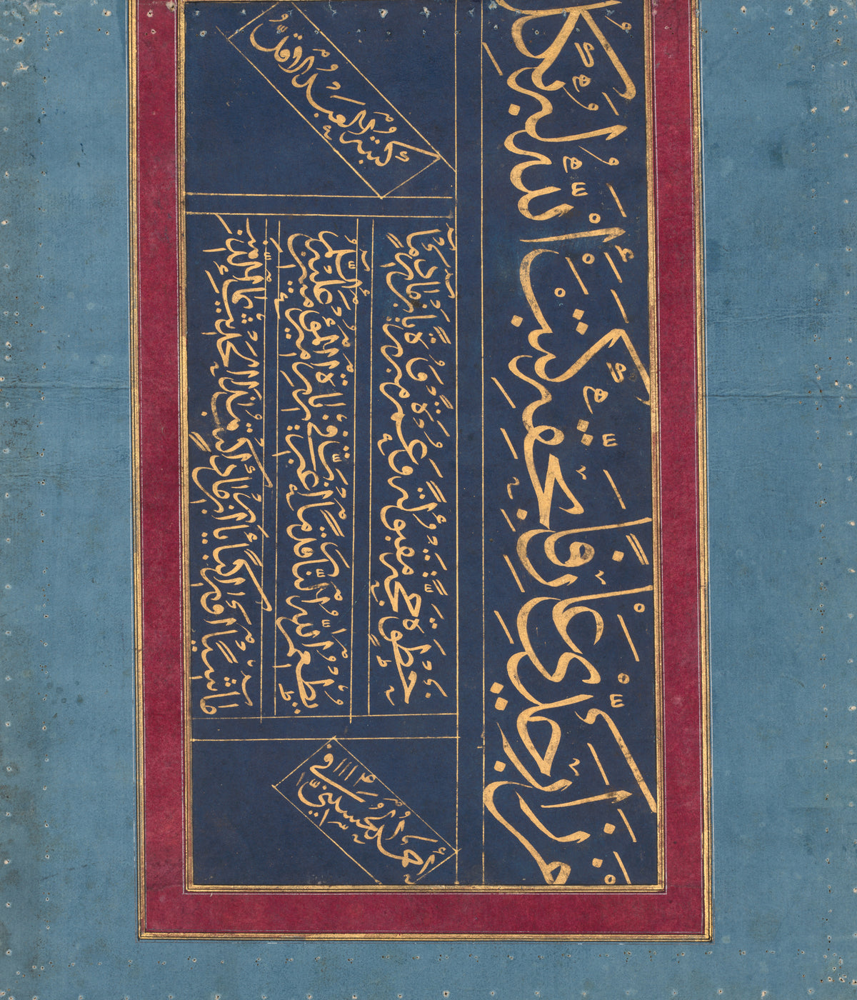 Calligraphy (Gold on Indigo) by Ahmad al-Husaini — Gold script on deep indigo, set upright in a crimson frame