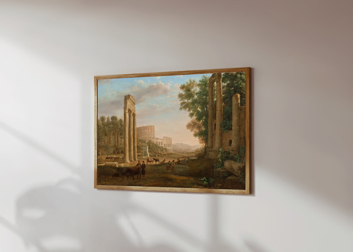 Framed art print of Capriccio with Ruins of the Roman Forum by Claude Lorrain, in a light wood frame on a sunlit white wall, seen at a slight angle
