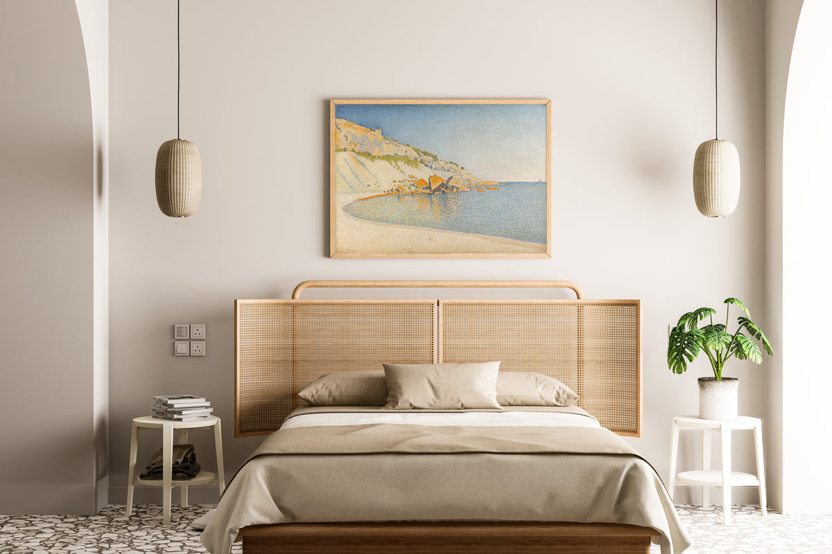 Framed art print of Cassis, Cap Lombard, Opus 196 by Paul Signac, above a cane-headboard bed