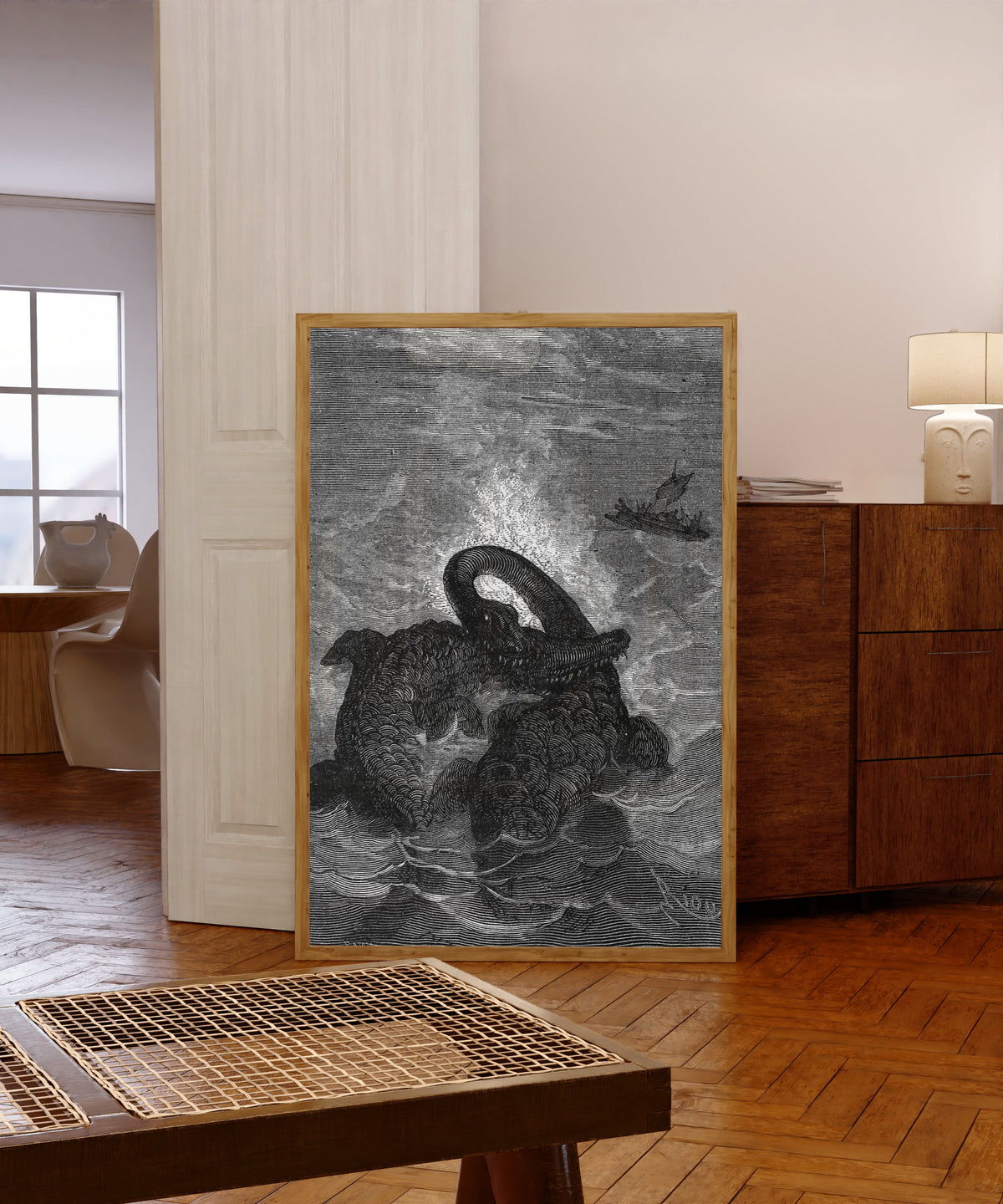 Framed art print of Ces animaux s'attaquent avec fureur (These animals… by Édouard Riou, in a light wood frame leaning in a warm room with a parquet floor