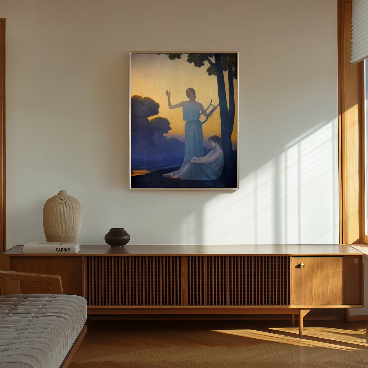 Framed art print of Chant du soir by Alphonse Osbert, in a thin light frame on a sunlit wall above a wooden sideboard