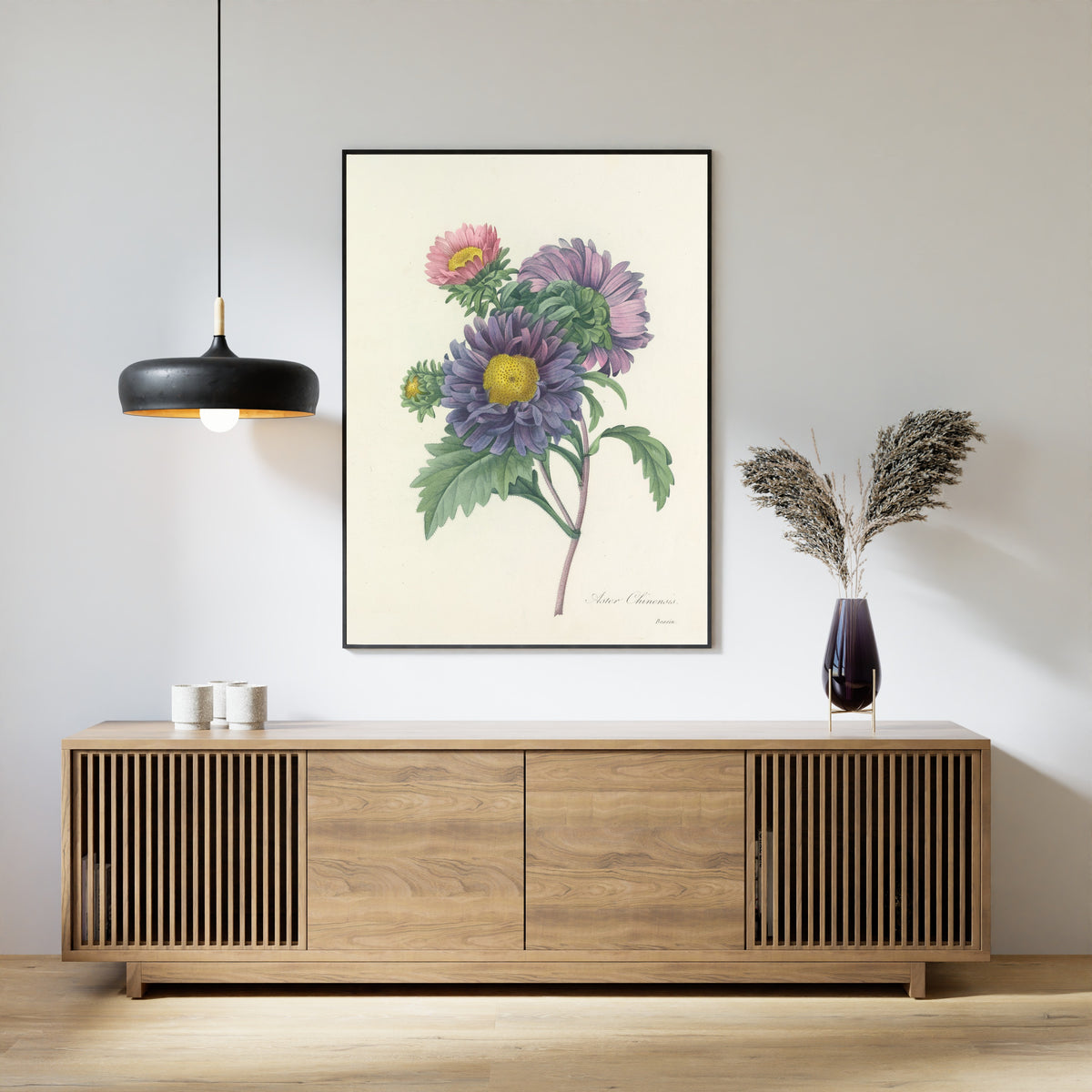 Framed art print of Choix des plus belles fleurs, Plate 10: Aster Chinensis by Pierre-Joseph Redouté, above a slatted wood sideboard