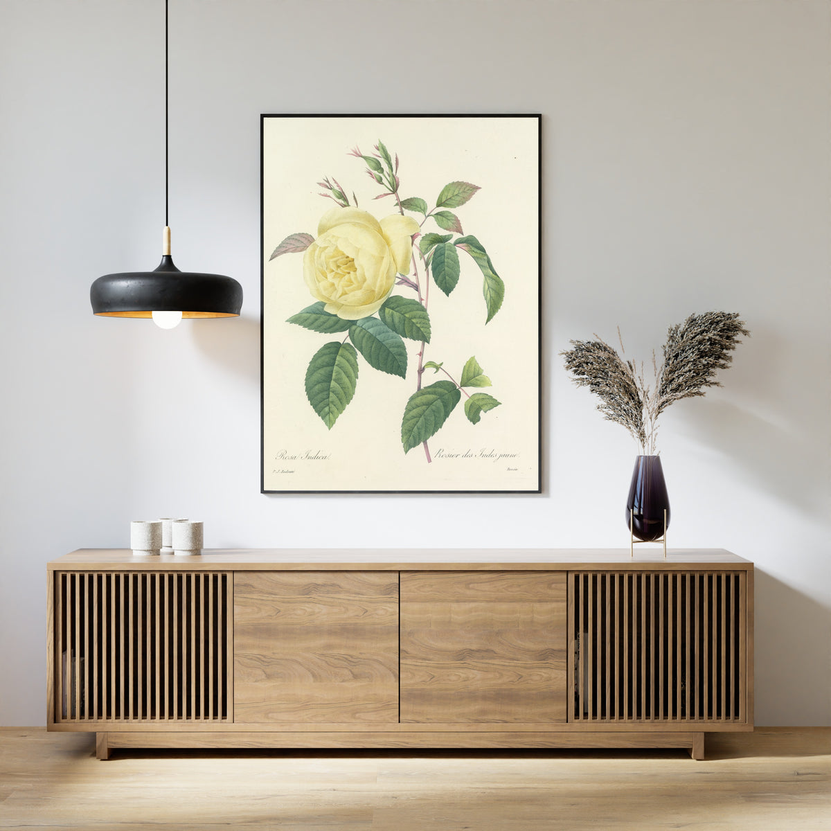 Framed art print of Choix des plus belles fleurs, Plate 100: Rosa Indica by Pierre-Joseph Redouté, above a slatted wood sideboard