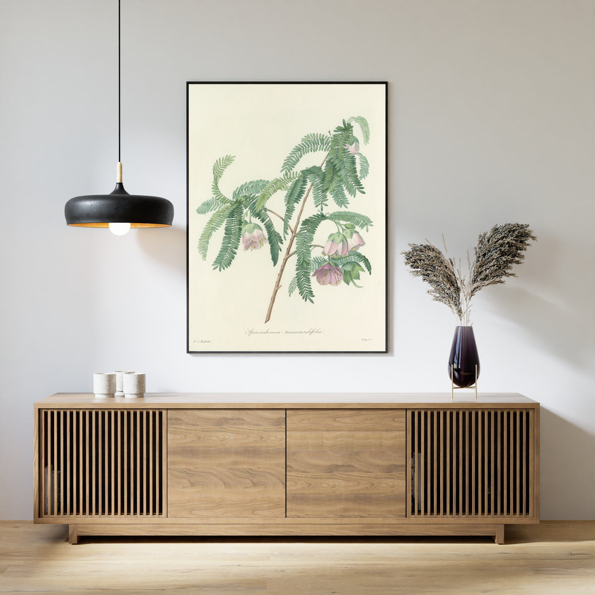 Framed art print of Choix des plus belles fleurs, Plate 103: Spaendoncea Tamarandifolia by Pierre-Joseph Redouté, above a slatted wood sideboard