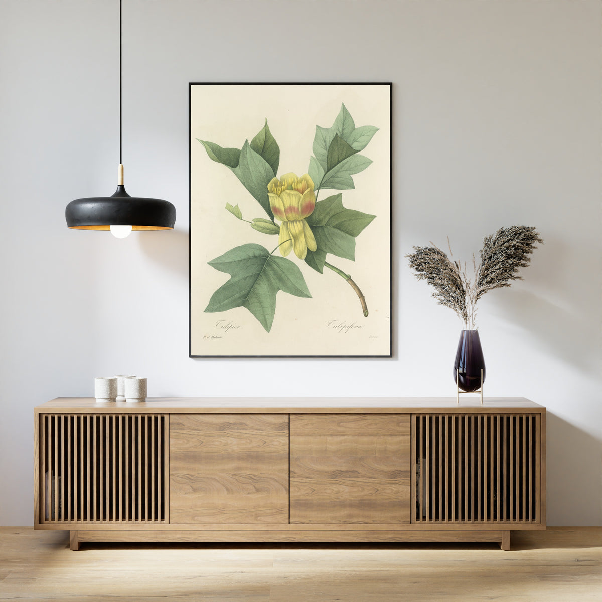 Framed art print of Choix des plus belles fleurs, Plate 110: Tulipifera by Pierre-Joseph Redouté, above a slatted wood sideboard