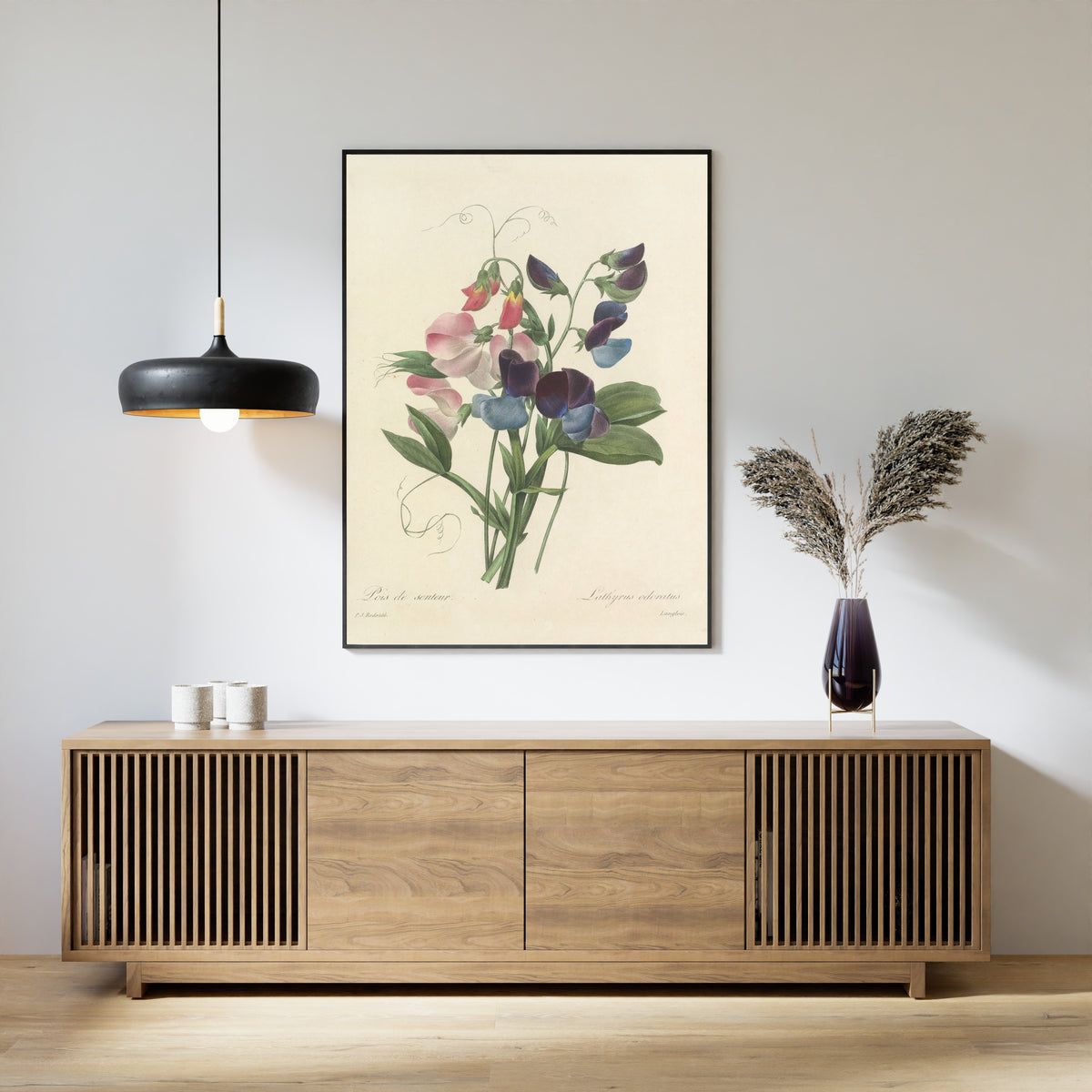 Framed art print of Choix des plus belles fleurs, Plate 39: Lathyrus Odoratus by Pierre-Joseph Redouté, above a slatted wood sideboard