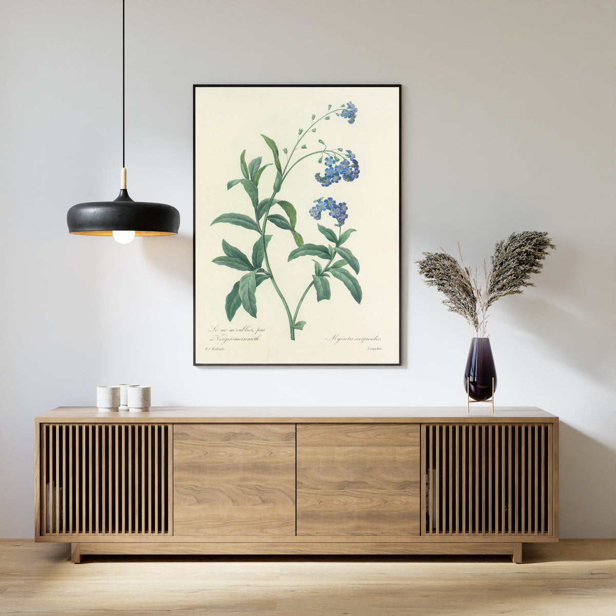 Framed art print of Choix des plus belles fleurs, Plate 50: Myosotis Scorpioides by Pierre-Joseph Redouté, above a slatted wood sideboard