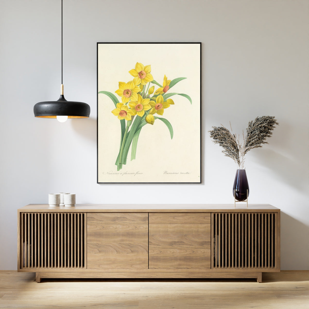 Framed art print of Choix des plus belles fleurs, Plate 52: Narcissus Tazetta by Pierre-Joseph Redouté, above a slatted wood sideboard