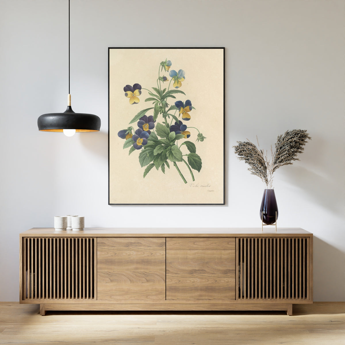 Framed art print of Choix des plus belles fleurs, Plate 66: Viola Tricolor by Pierre-Joseph Redouté, above a slatted wood sideboard
