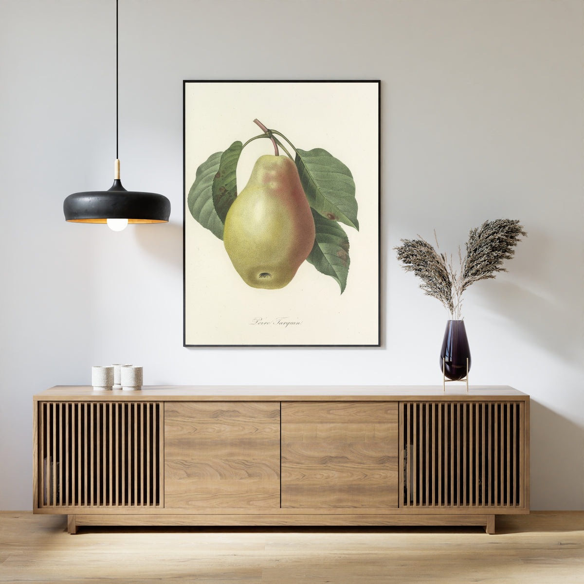 Framed art print of Choix des plus belles fleurs, Plate 78: Poire Tarquin by Pierre-Joseph Redouté, above a slatted wood sideboard