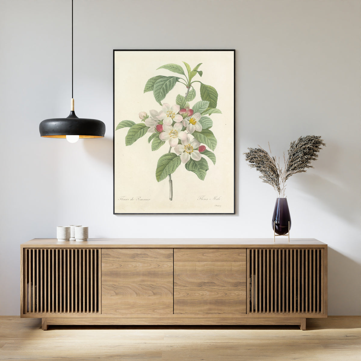 Framed art print of Choix des plus belles fleurs, Plate 79: Flores Mali by Pierre-Joseph Redouté, above a slatted wood sideboard
