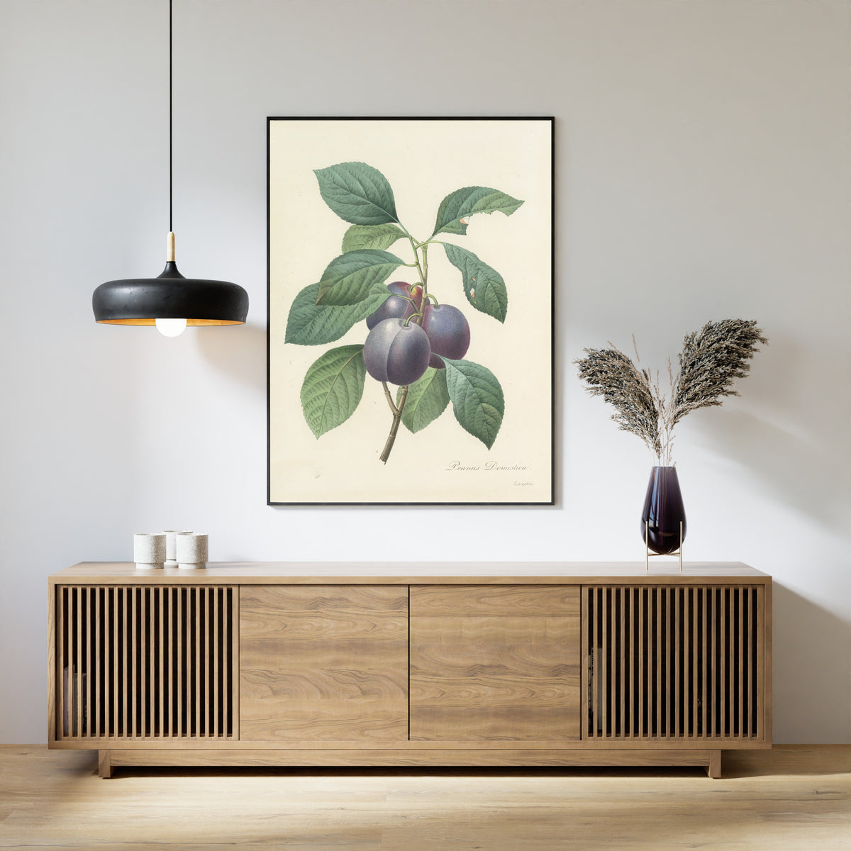 Framed art print of Choix des plus belles fleurs, Plate 83: Prunus Domestica by Pierre-Joseph Redouté, above a slatted wood sideboard