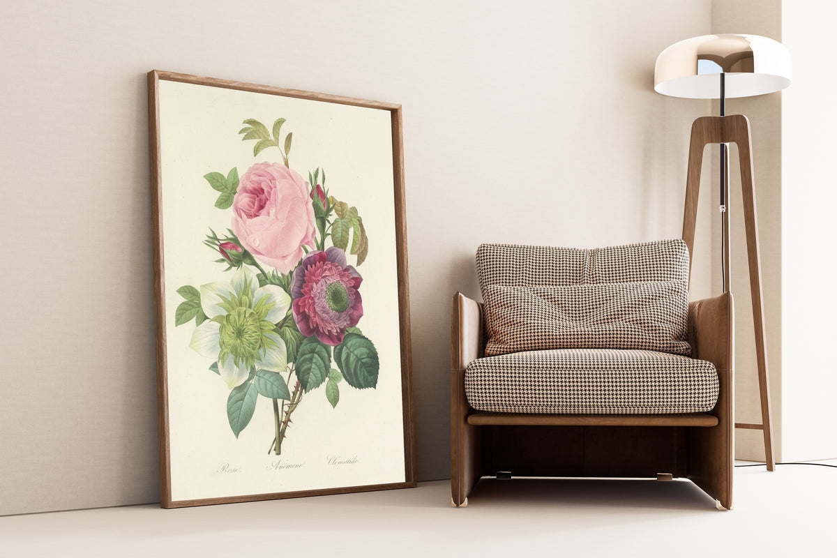 Framed art print of Choix des plus belles fleurs, Plate 95: Rose, Anémone… by Pierre-Joseph Redouté, leaning against a wall beside an armchair and a floor lamp